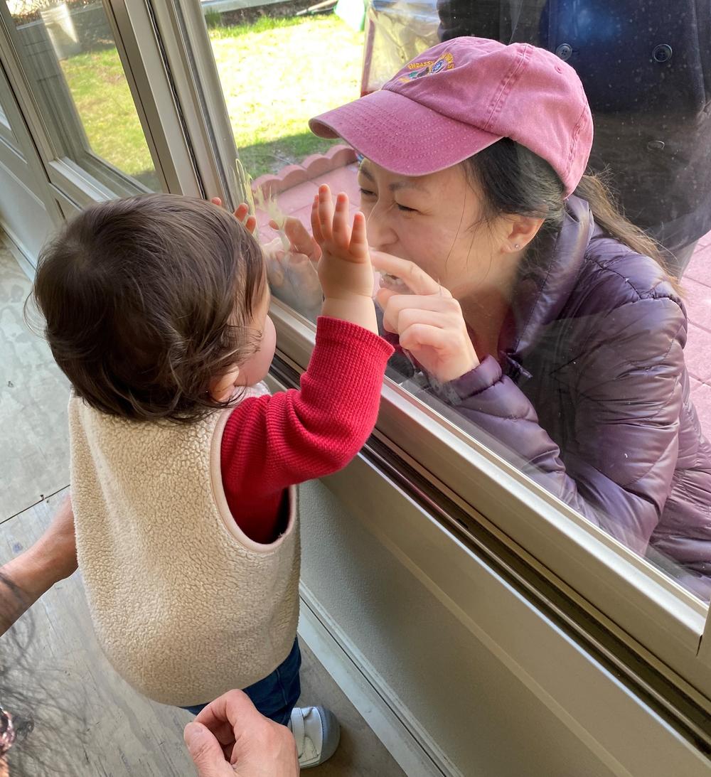 Dr. Chen visits with her son, who stayed with her parents in New Jersey while she worked in the ER in New York.