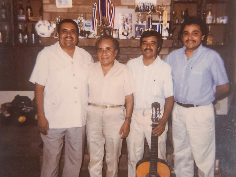 The Aldaco family of Phoenix suffered multiple losses in this year of unfathomable pain. Three brothers perished in the pandemic: Jose (left) in July, Heriberto Jr. (right) in December and Gonzalo (holding guitar) in February. They appear in this undated family photo with their father (second from left).