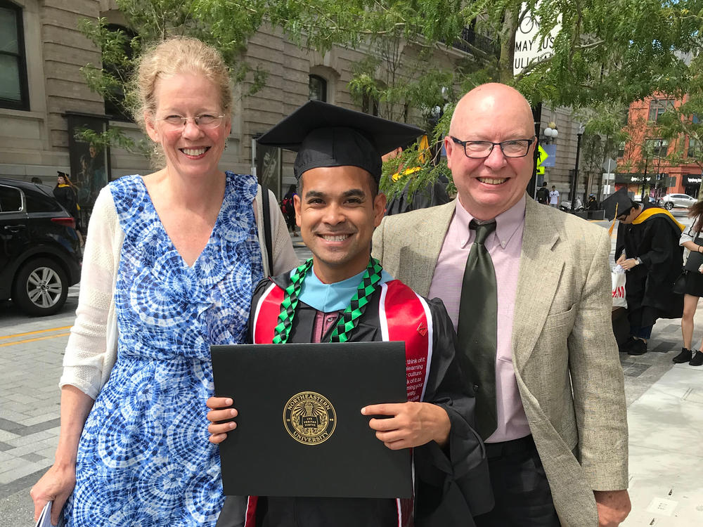 Hing Potter with his parents the day he got his master's degree from Northeastern University in Boston in 2019.