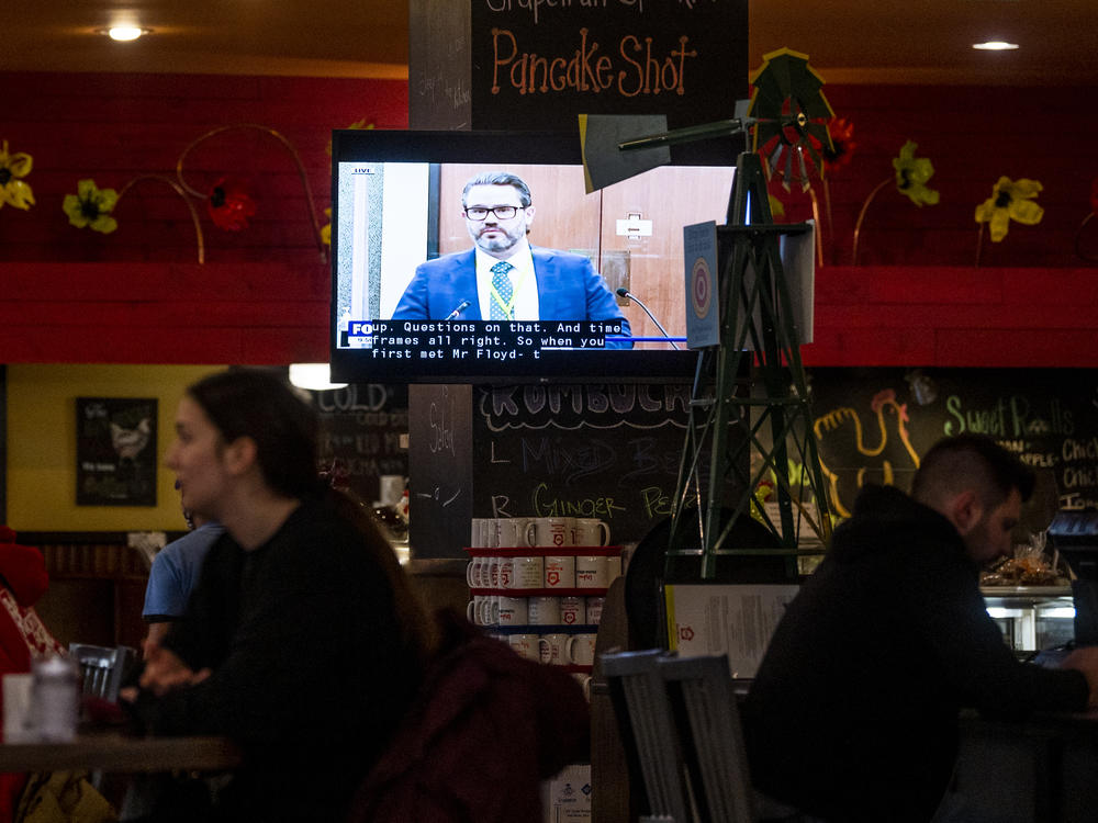 The trial of former officer Derek Chauvin has completed its fifth day of witness testimony. Here, a Minneapolis restaurant shows the trial on TV in its dining room Thursday.