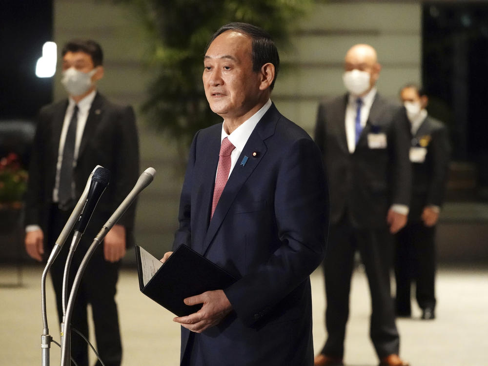 Japanese Prime Minister Yoshihide Suga speaks to media in Tokyo this month. Suga will take part in a Friday summit meeting with President Biden, the first foreign leader to meet the president face to face.