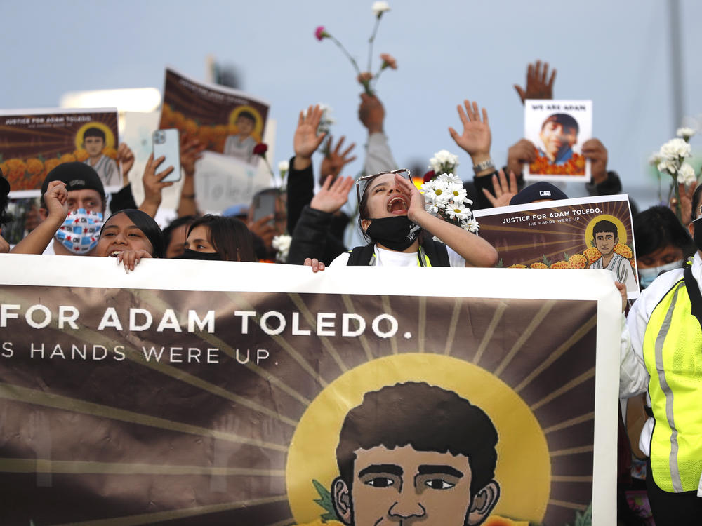 Demonstrators attend a peace walk on Sunday honoring the life of 13-year-old Adam Toledo in Chicago's Little Village neighborhood.