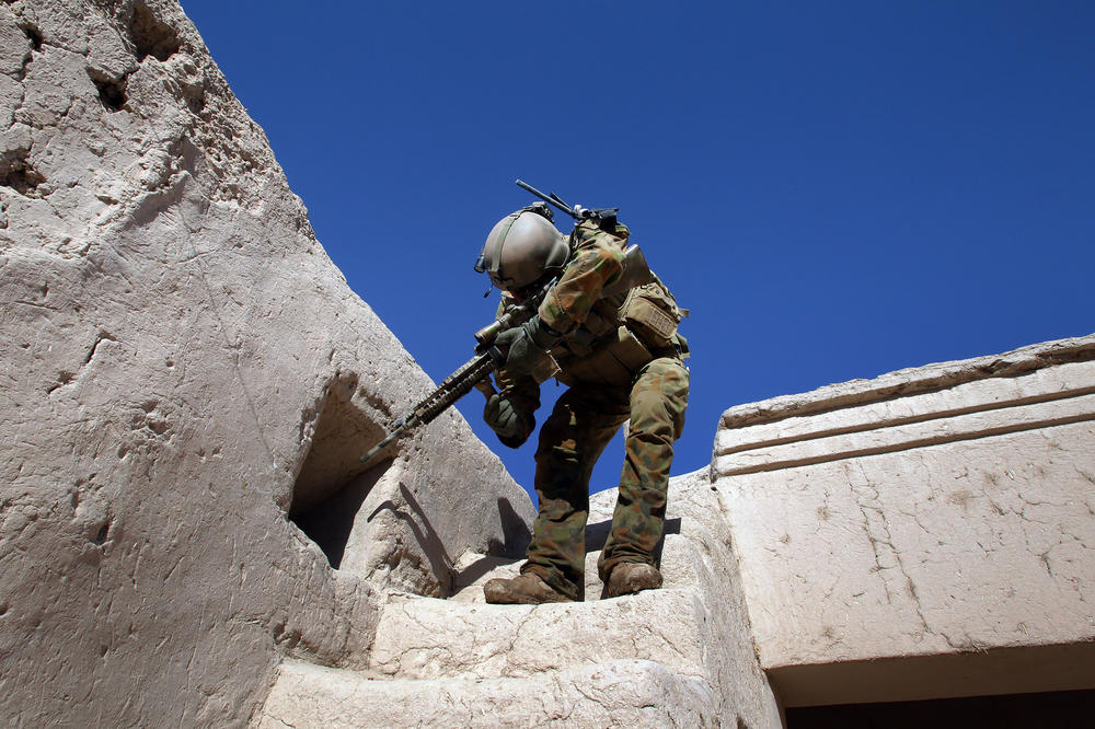 An Australian sergeant searches a village in Uruzgan province, Afghanistan.