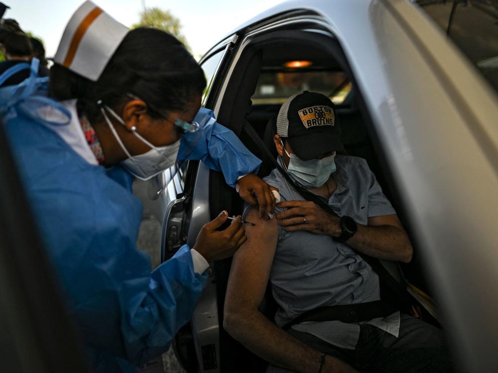 A man receives a dose of the AstraZeneca COVID-19 vaccine at the Rommel Fernández Stadium in Panama City, Panama. In the absence of Food and Drug Administration authorization, the U.S. government has been sitting on a stockpile of doses.