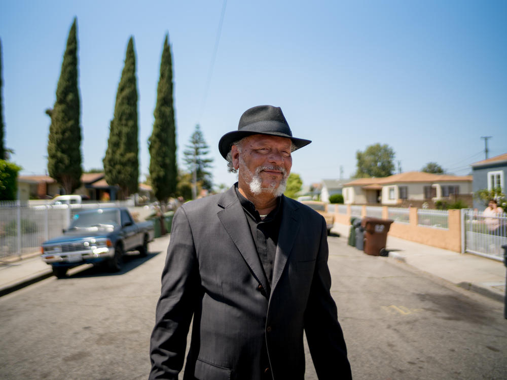 Robert Lee Johnson in his old neighborhood in Compton. Johnson remembers moving in one day in 1961. 