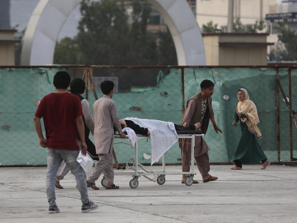 An injured school student is transported to a hospital after a bomb explosion near a school in Kabul, Afghanistan, on Saturday.