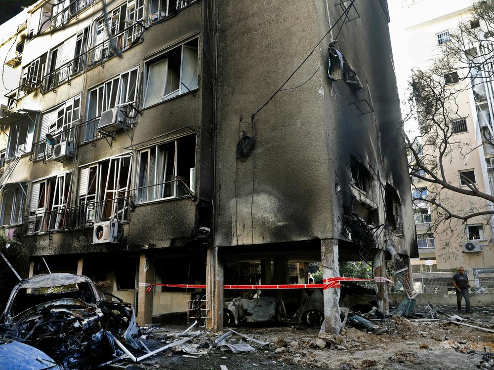 A residential building shows extensive damage in the central Israeli city of Petah Tikva, Thursday, after being struck by a rocket fired from the Hamas-controlled Gaza Strip.