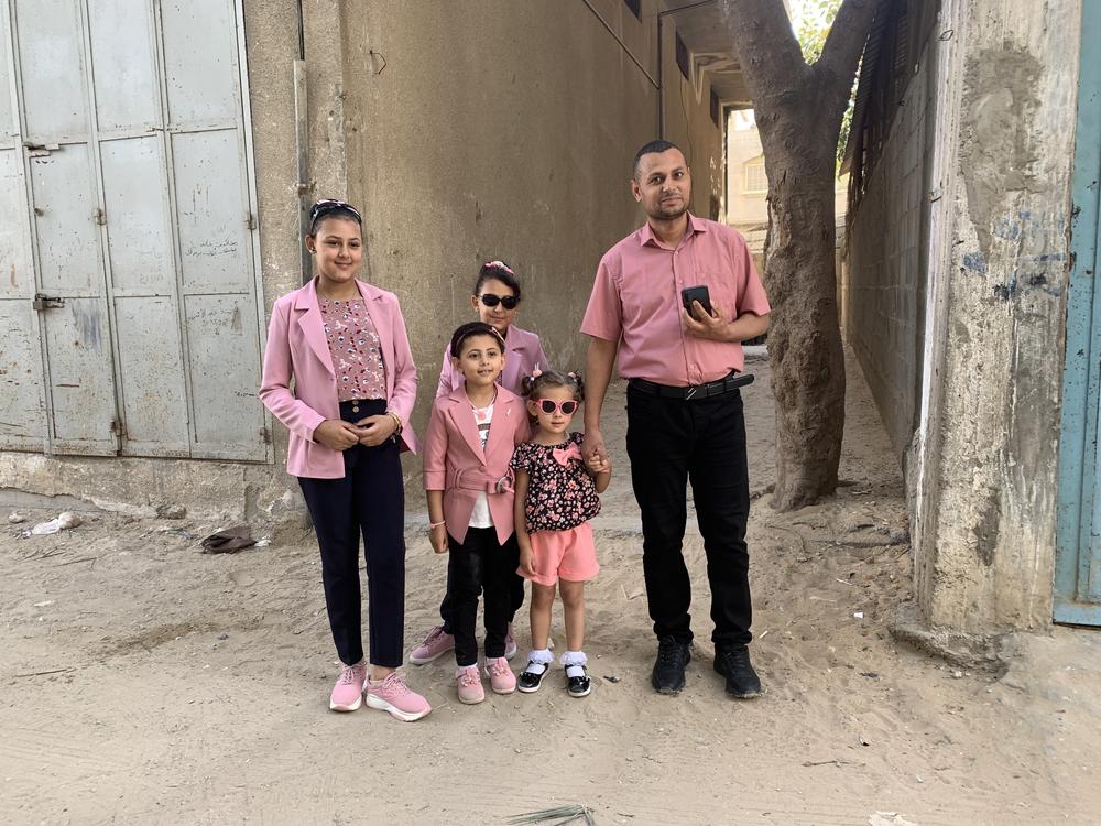 Ashraf and four daughters dressed up for Eid holiday, celebrated a week late, in Gaza.