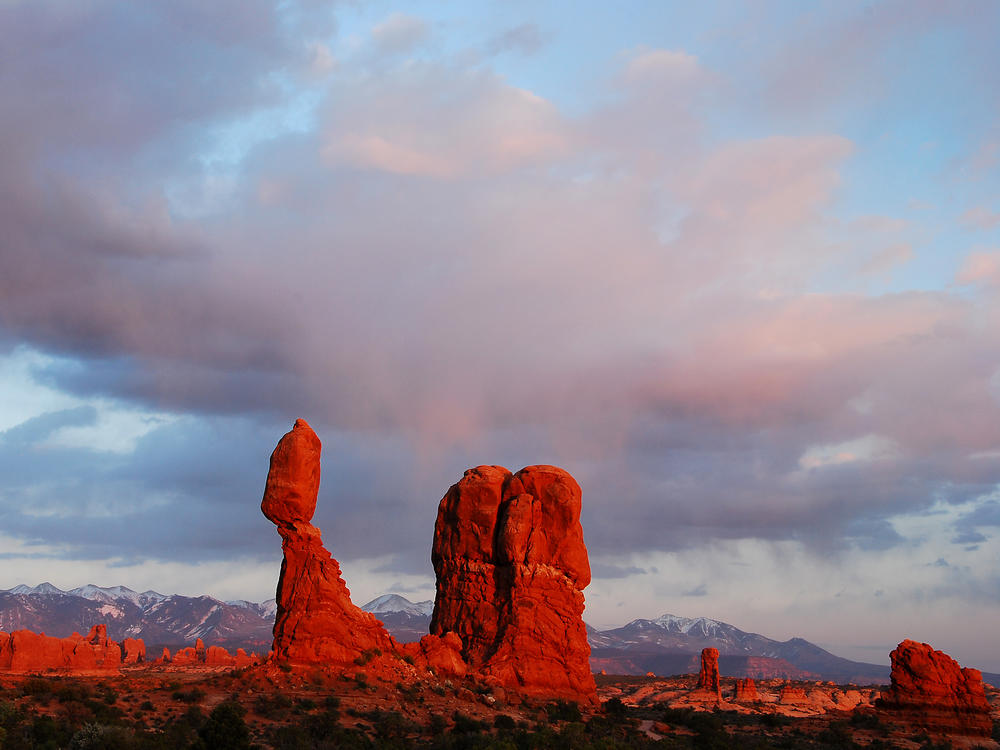 Balanced Rock at Arches National Park. Arches and Canyonlands both offer hiking, camping, biking and more for visitors, without the crowds common for Utah's Zion National Park.