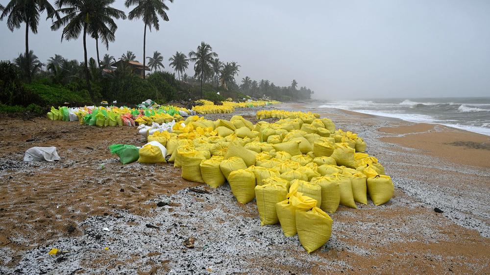 Sacks containing debris washed ashore from the X-Press Pearl are pictured on a beach in Colombo on Thursday.