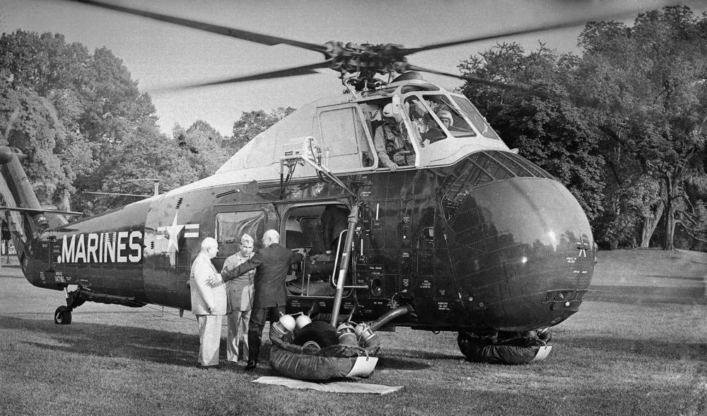 President Dwight Eisenhower and Soviet Premier Khrushchev prepare to board a helicopter at the White House for a flight to Camp David on Sept. 25, 1959.