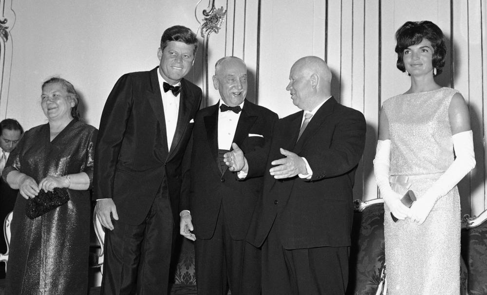 Soviet Premier Nikita Khrushchev (second from right) speaks with Austrian President Adolf Schaerf (center) as President John F. Kennedy listens at Schoenbrunn Palace in Vienna on June 3, 1961. To the left of the leaders is Nina Khrushchev, and at right is Jacqueline Kennedy.