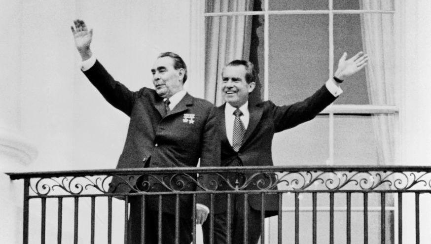 General Secretary of the Communist Party of the Soviet Union Leonid Brezhnev (left) and President Richard Nixon wave at the balcony of the White House on June 18, 1973.