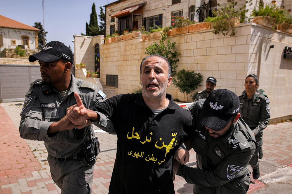 Israeli security forces detain a Palestinian demonstrator outside the Israeli Central Court in East Jerusalem Thursday during a protest over Israel's planned evictions of Palestinian families from homes in the eastern sector's Silwan district.