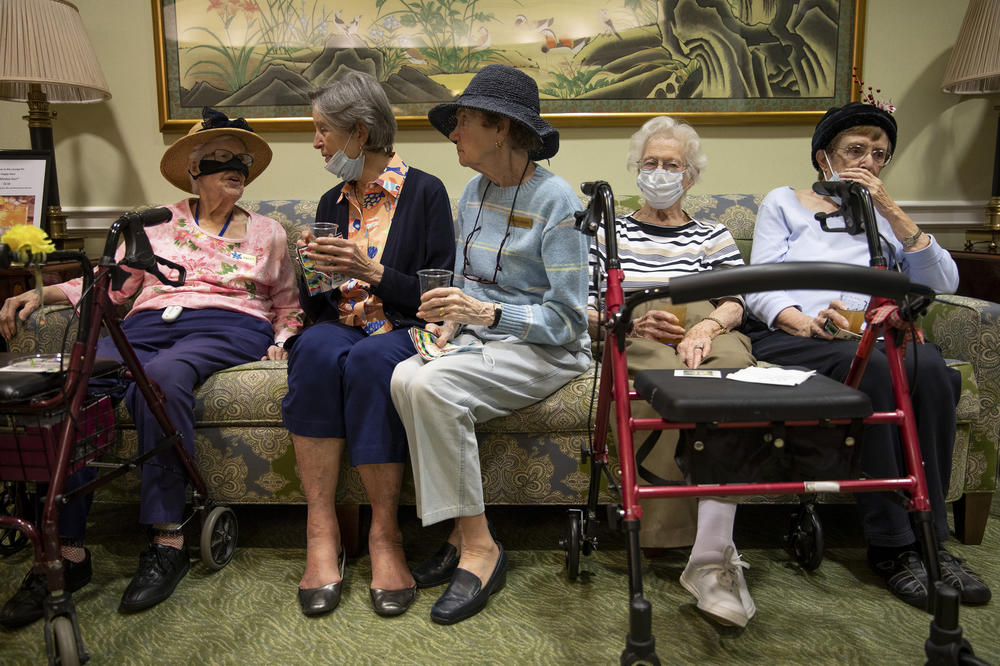 Residents at Goodwin House, a senior living facility in the greater Washington area, visit with each other for 