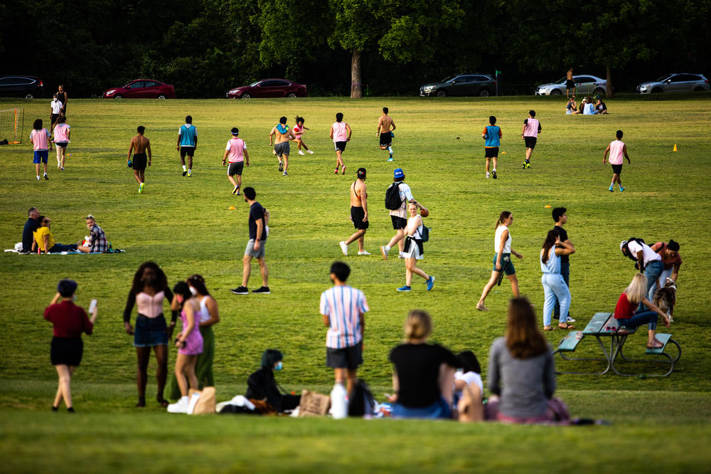 Crowds socialize and play sports at Zilker Metropolitan Park in Austin on May 13.