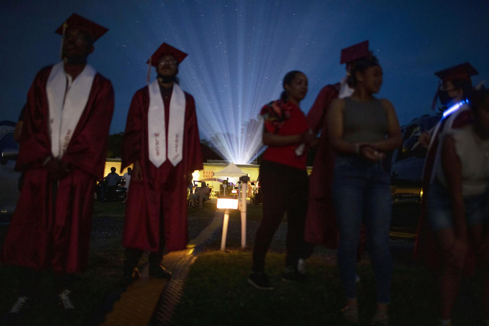 The projector light beams over the crowd at Bengies Drive-In Theatre as Washington Latin's graduation ceremony gets underway.