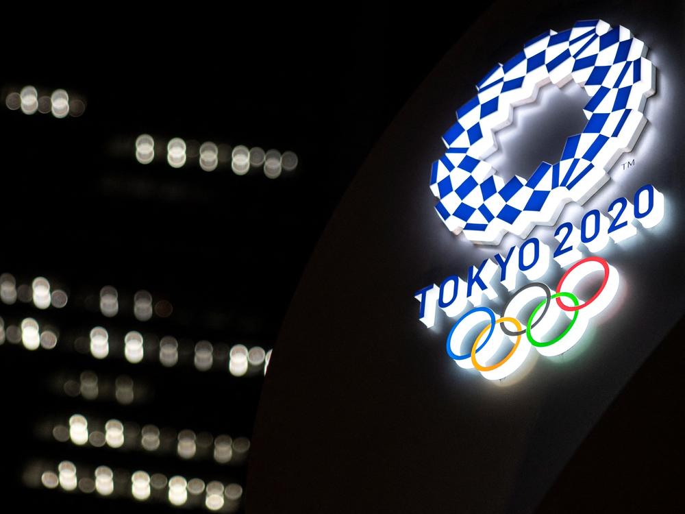 The Tokyo 2020 Olympic Games logo is pictured outside the Tokyo station in Tokyo on June 22.