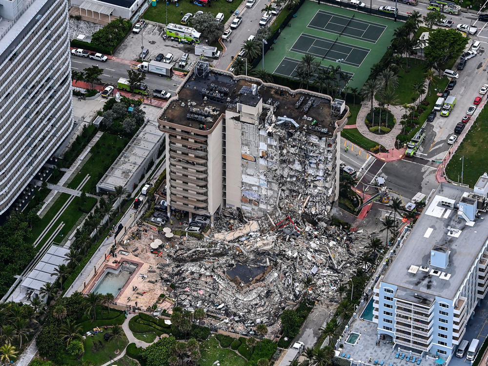 An aerial view shows search and rescue personnel working on site after the partial collapse of the Champlain Towers South in Surfside, north of Miami Beach, on Thursday.
