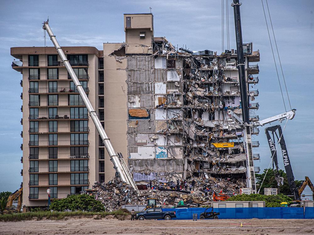 Search and Rescue teams look for survivors in the partially collapsed 12-story Champlain Towers South condo building on June 30, 2021 in Surfside, Fla. Four more bodies were found on Wednesday.