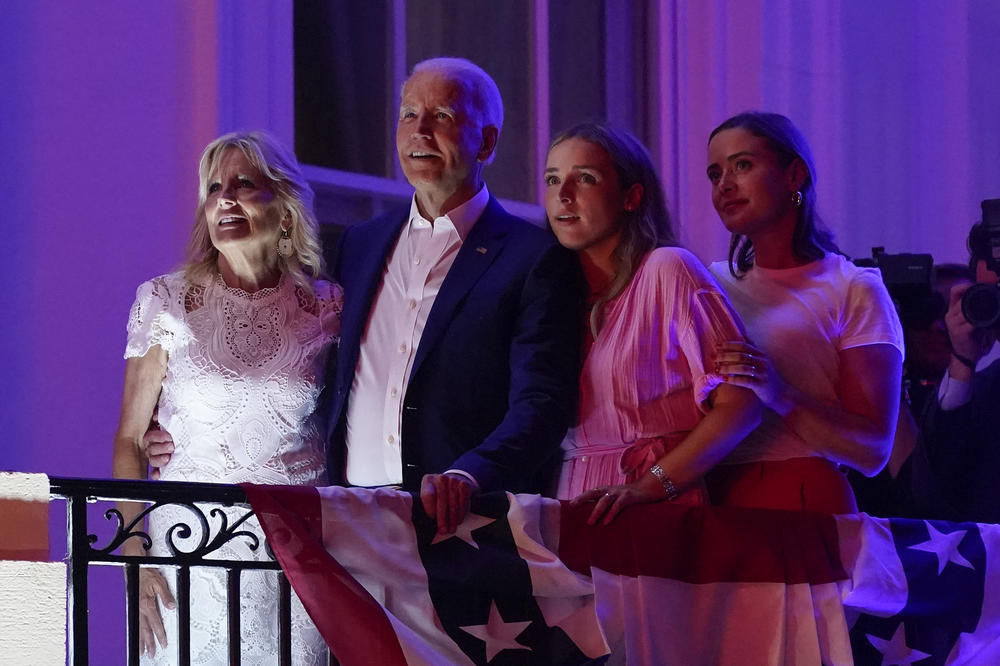 President Joe Biden and first lady Jill Biden view fireworks with granddaughters Finnegan Biden, second from right, and Naomi Biden during an Independence Day celebration on the South Lawn of the White House.