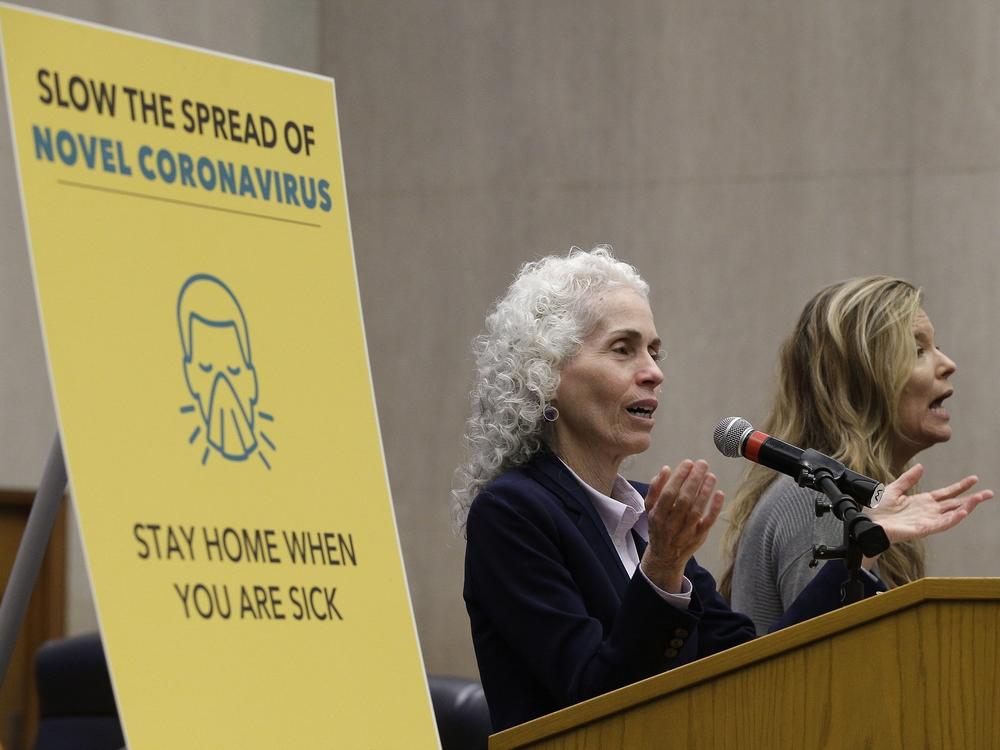 Los Angeles County Public Health Director Barbara Ferrer, left, takes questions at a news conference on March 12, 2020.