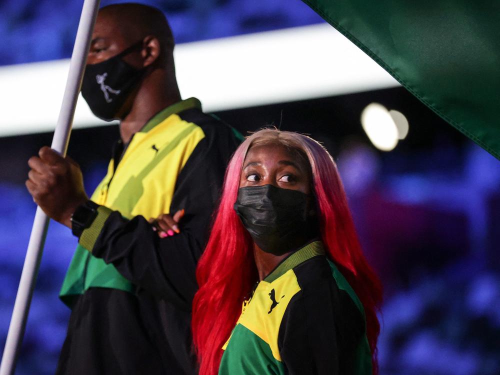 Jamaica's flag bearers Ricardo Brown (L) and Shelly-Ann Fraser-Pryce lead the delegation.