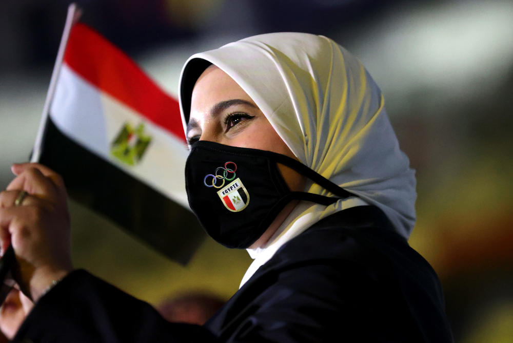 A member of Egypt's team waves a flag during the opening ceremony.