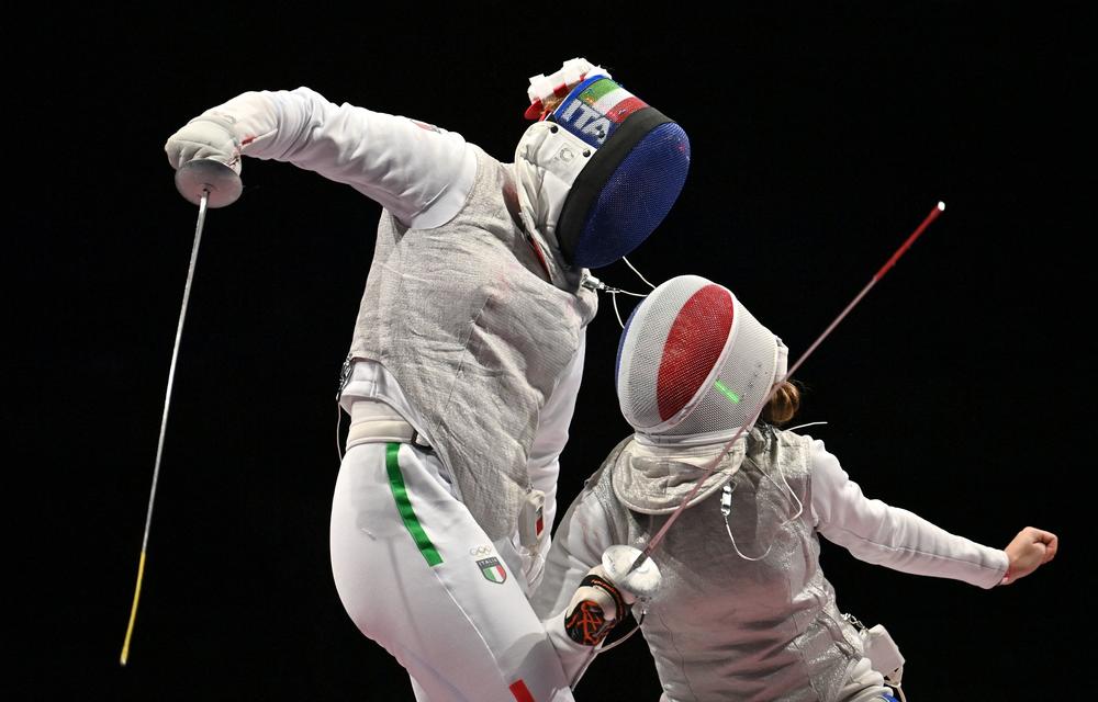 Italy's Alice Volpi, left, compete against France's Pauline Ranvier in the women's foil team semifinal bout on July 29, 2021.