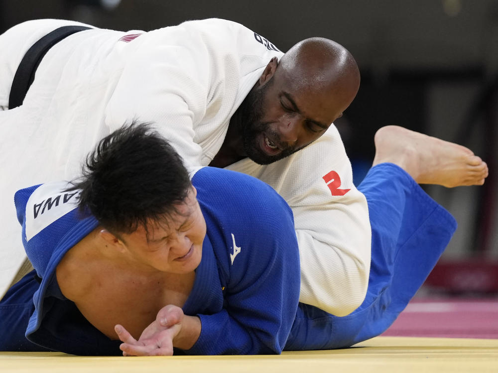 Riner (top) and Japan's Hisayoshi Harasawa compete Friday during the men's over 100-kilogram bronze medal judo match.