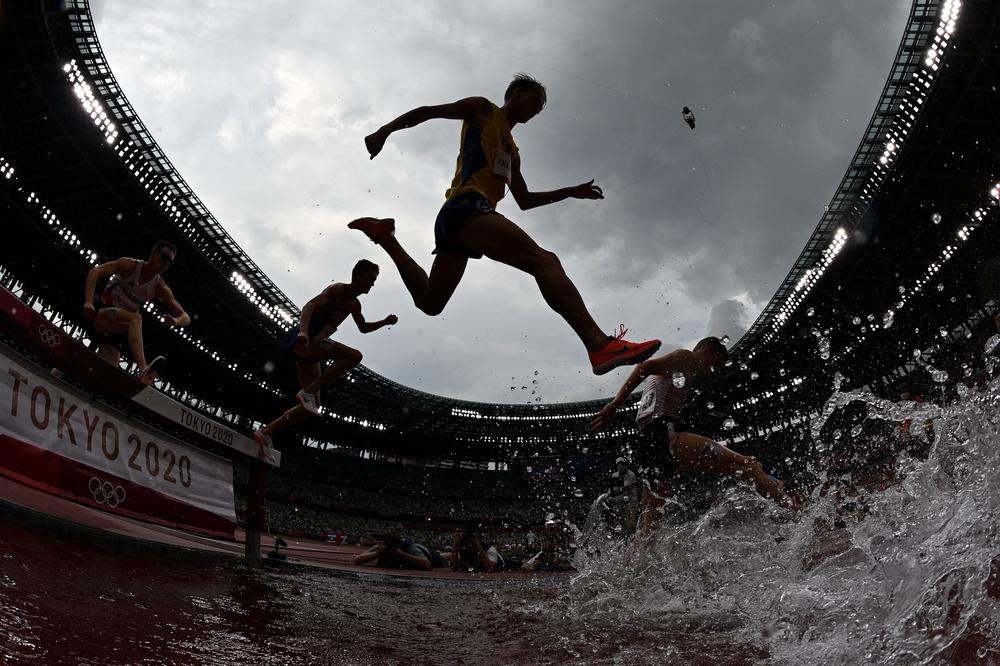 Athletes compete in the men's 3000m steeplechase heats on July 30, 2021.