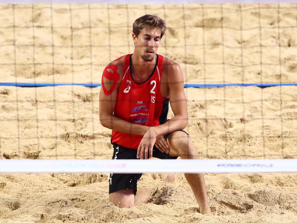 Taylor Crabb, shown here during a 2019 beach volleyball match, tested positive upon arrival to Tokyo and was not able to compete at the Olympic Games.
