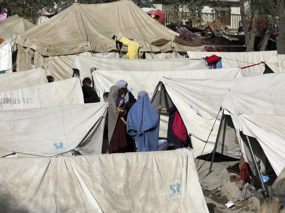 Internally displaced Afghans who have fled from northern provinces due to fighting between the Taliban and Afghan security personnel take refuge Friday in a park in Kabul.