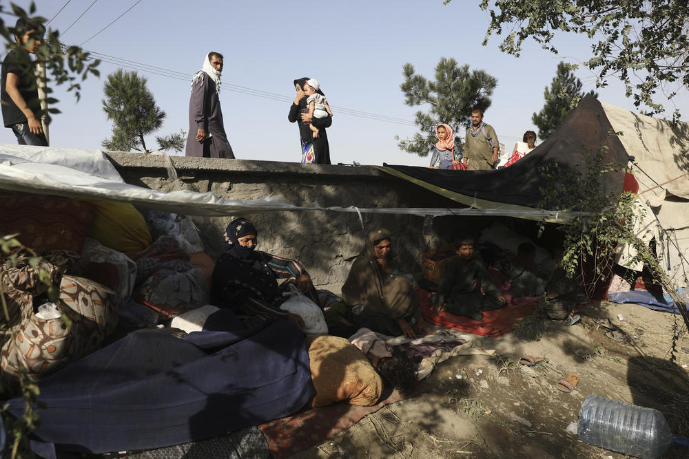 <strong>Fri., Aug. 13:</strong> Internally displaced Afghans from northern provinces, who fled their home due to fighting between the Taliban and Afghan security personnel, take refuge in a public park Kabul.