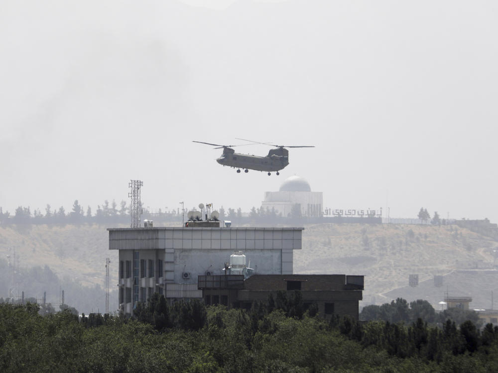 <strong>Sun., Aug. 15:</strong> A U.S. Chinook helicopter flies near the U.S. Embassy in Kabul, Afghanistan