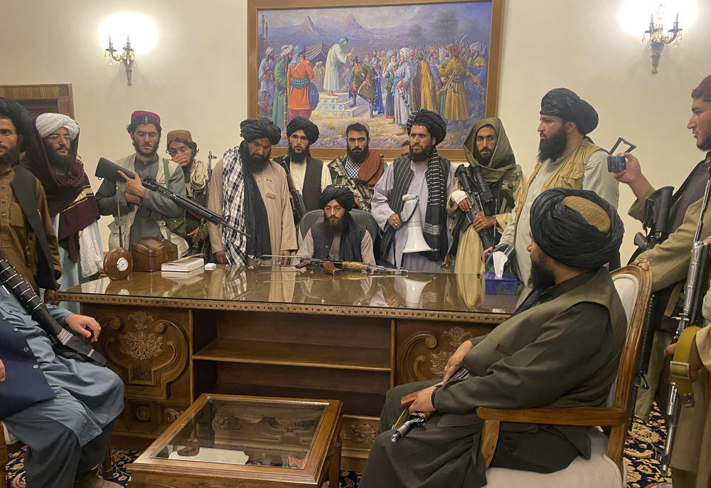 <strong>Sun., Aug. 15:</strong> Taliban fighters take control of Afghan presidential palace after the Afghan President Ashraf Ghani fled the country, in Kabul.