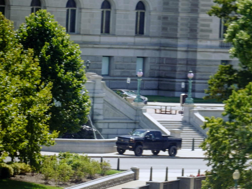 A pickup is parked Thursday on the sidewalk in front of the Library of Congress' Thomas Jefferson Building, as seen from a window of the U.S. Capitol. A man sitting in the truck told police he had a bomb. He later surrendered.