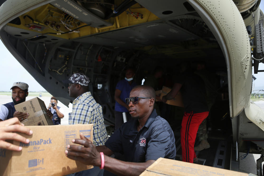 A U.S. Army helicopter at the Toussaint Louverture International Airport on Wednesday preparing to deliver humanitarian aid to remote Haitian towns affected by the earthquake.
