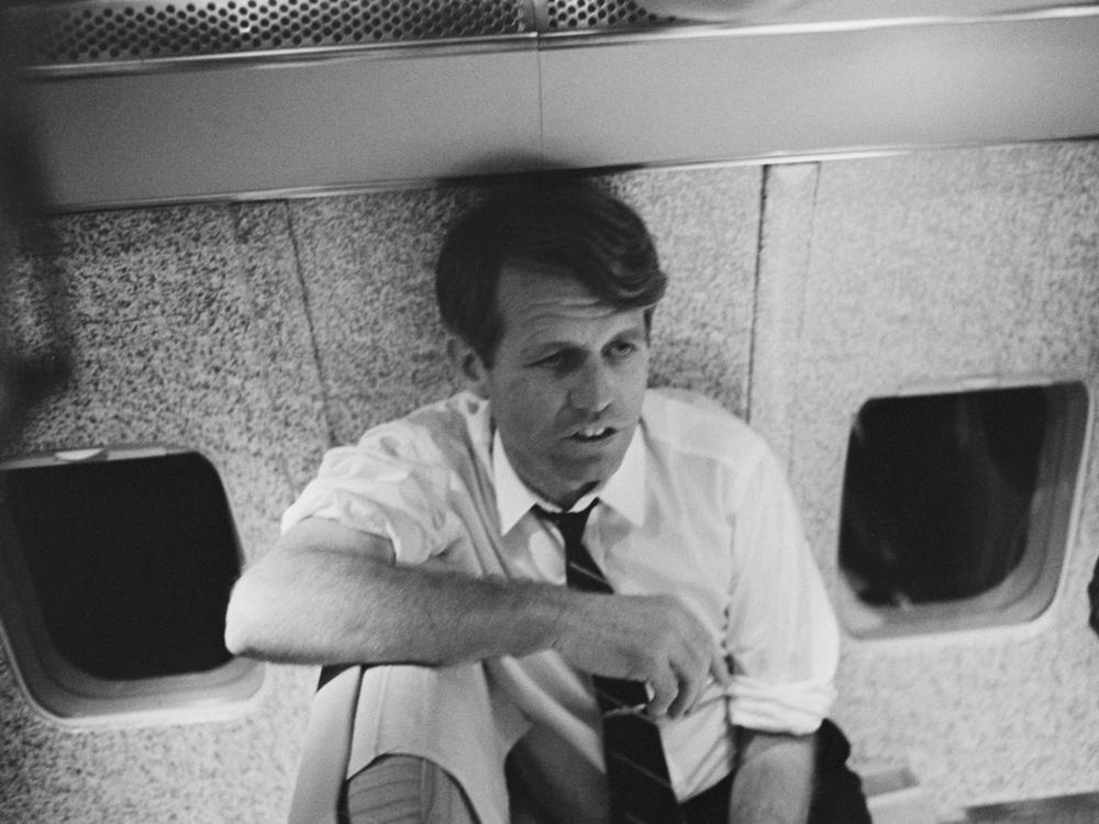 Sen. Robert Kennedy on an airplane during his presidential election tour in 1968.