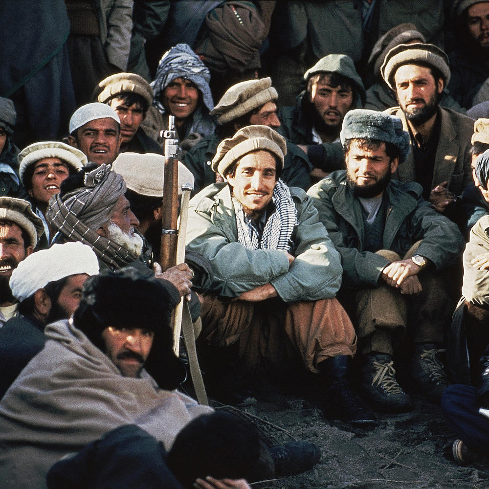 Afghan guerrilla leader, Ahmad Shah Massoud (center) is surrounded by rebel commanders at a meeting in the Panjshir Valley in northeast Afghanistan, in 1984.