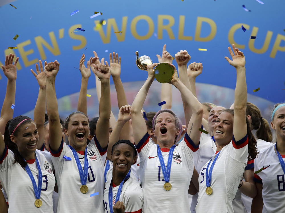 U.S. soccer player Megan Rapinoe raises the trophy in 2019 after winning the Women's World Cup final between the U.S. and The Netherlands in Decines, outside Lyon, France.