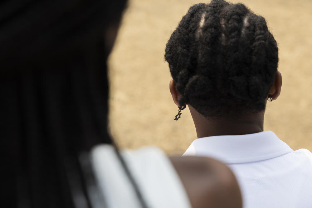 Kenya Edelhart wears a Star of David earring in her left ear. She's worn it every day for the past three years because people kept telling wasn't Jewish.