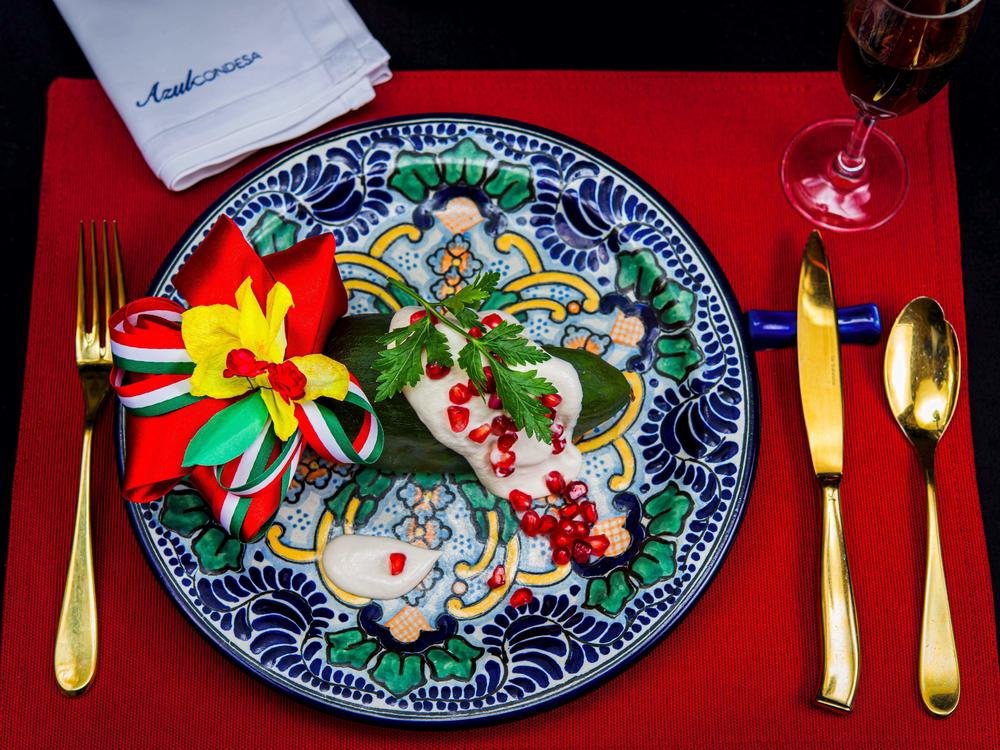 The chile en nogada — a stuffed poblano pepper covered in a walnut sauce — has become a classic Mexican dish. The version plated here comes from Ricardo Muñoz Zurita's Azul Condesa restaurant in Mexico City.