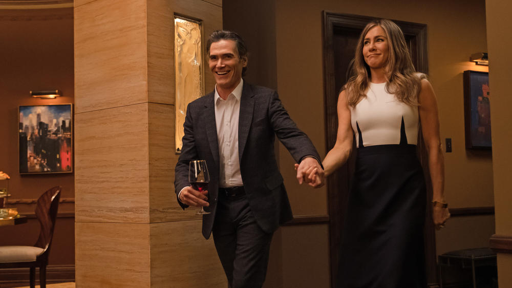 Cory (Billy Crudup), Alex (Jennifer Aniston) and the interesting darts in Alex's dress all are hoping for a nice dinner.