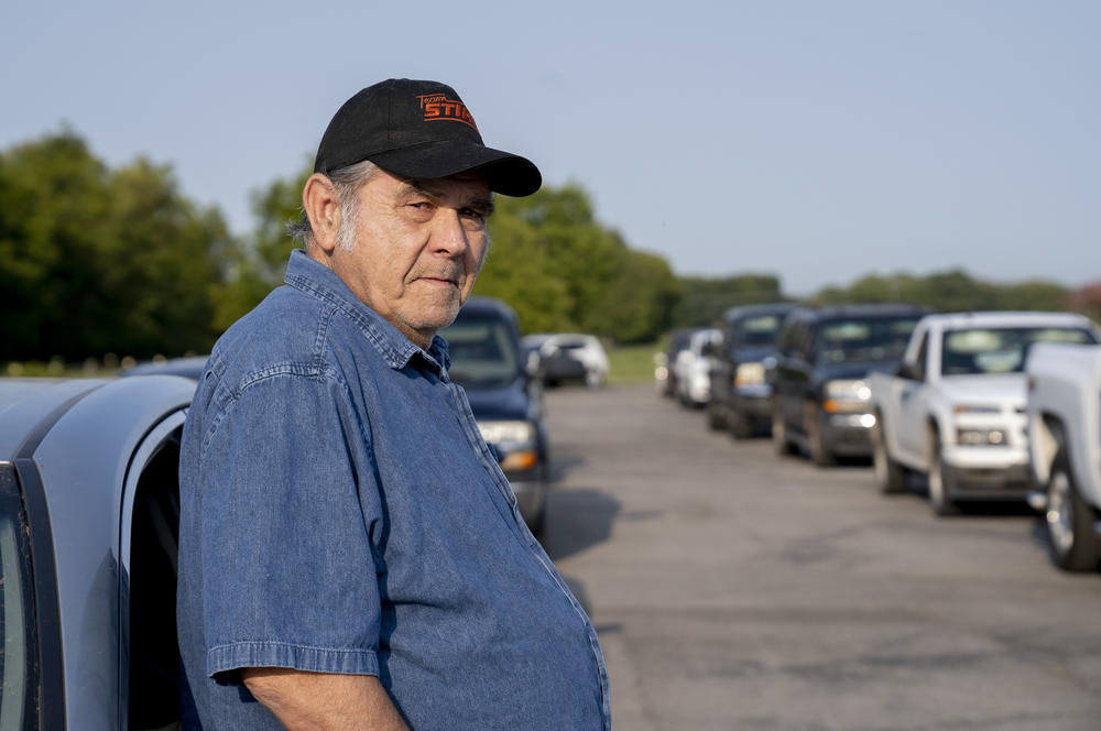 Lloyd Abshier, 70, waits for a drive-through food distribution event to begin in Columbia, Tenn. He arrived over two hours early to get food for his wife and two kids. Despite the hard times, he recently gave $30 to an elderly man in need: 