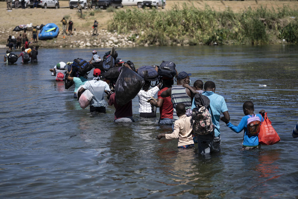 Haitian immigrants cross the Rio Grande into Del Rio, Texas from Ciudad Acuña, Mexico.