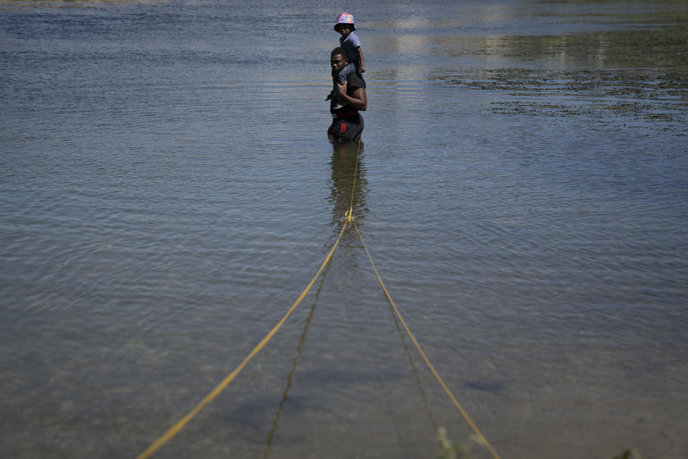 Migrants cross the Rio Grande into the U.S.