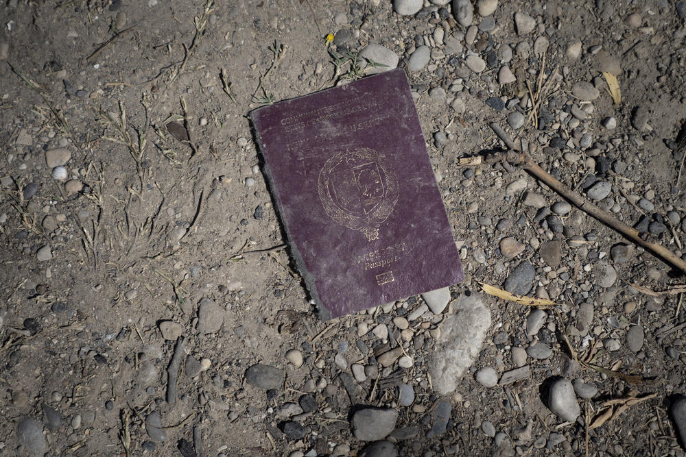 A discarded passport lies in a makeshift migrant camp in Ciudad Acuña, Mexico.