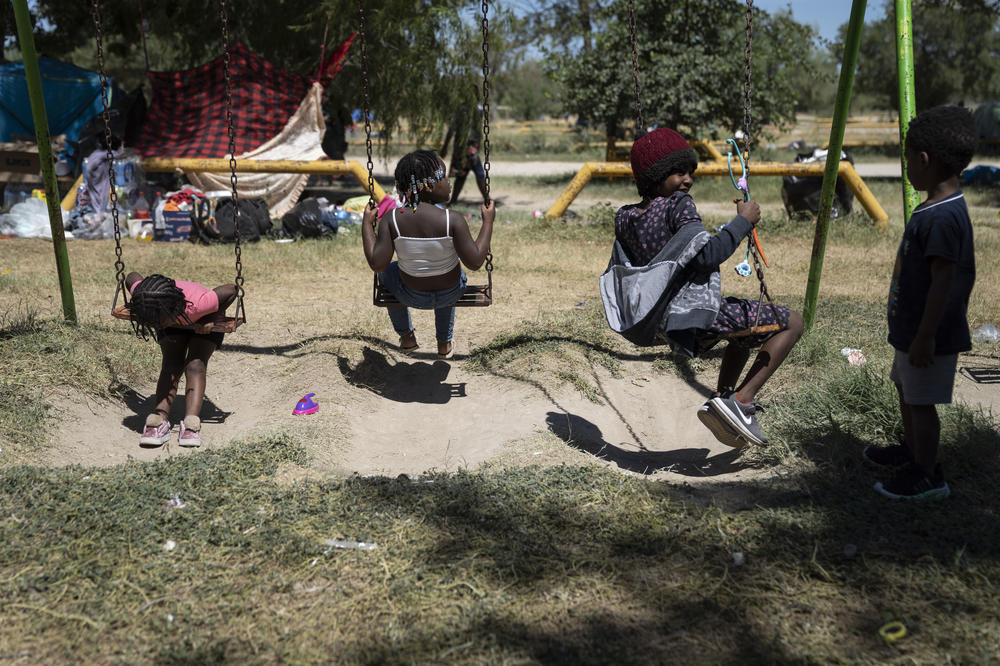 Children play in a makeshift migrant camp in Ciudad Acuña, Mexico.