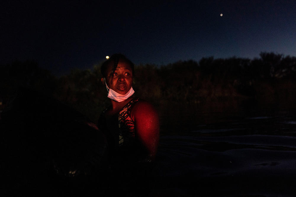 A Haitian woman crosses the Rio Grande into the U.S. from Ciudad Acuña, Mexico.